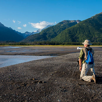 Bear Viewing Trips in Alaska Soliltary Photographer on Sand